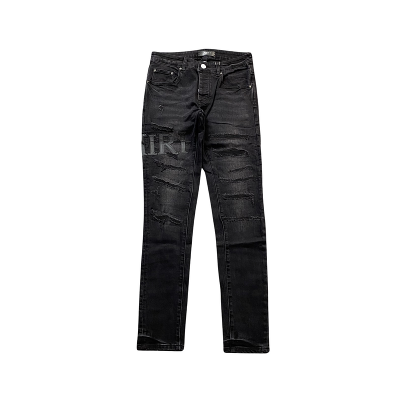 Calça Amiri Skinny Jeans Staggered Logo Black em fundo branco